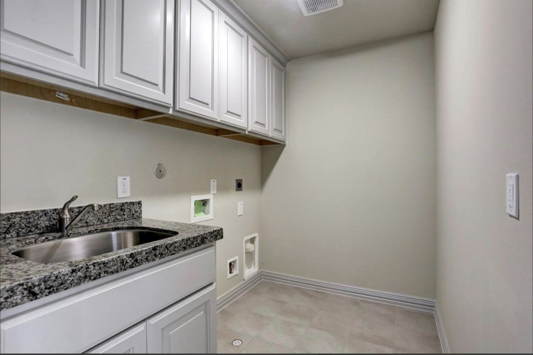 13621 Teal Bluff Lane Houston, TX 77077 - Photo 17 of 29 a kitchen with sink cabinets and utility