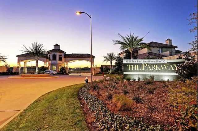 a view of a street with a cars parked on the road