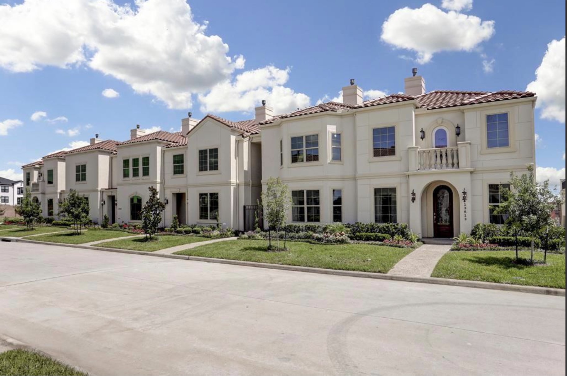 13621 Teal Bluff Lane Houston, TX 77077 - Photo 24 of 29 a front view of residential houses with yard and green space