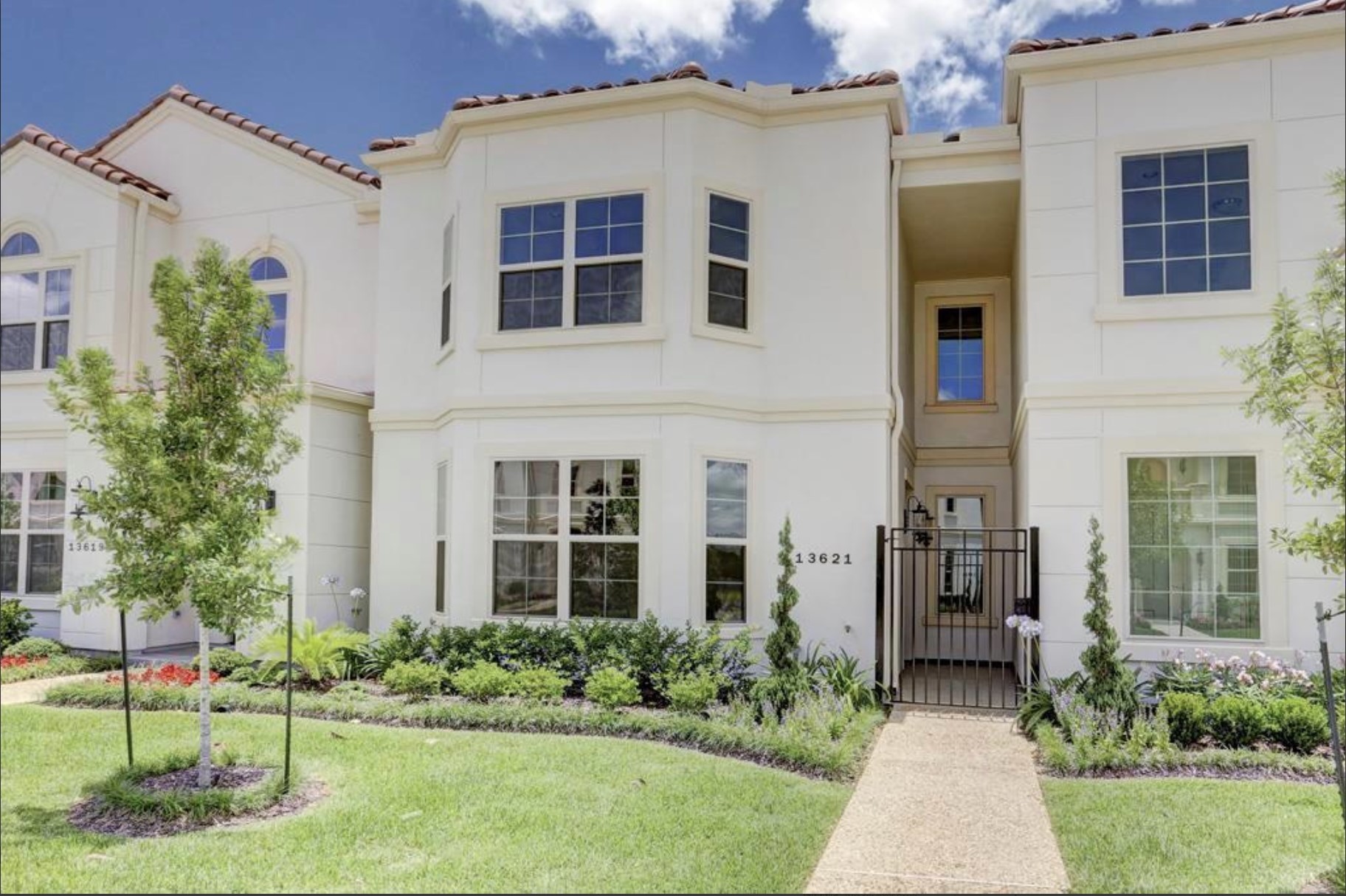 13621 Teal Bluff Lane Houston, TX 77077 - Photo 26 of 29 a front view of a house with a yard and trees