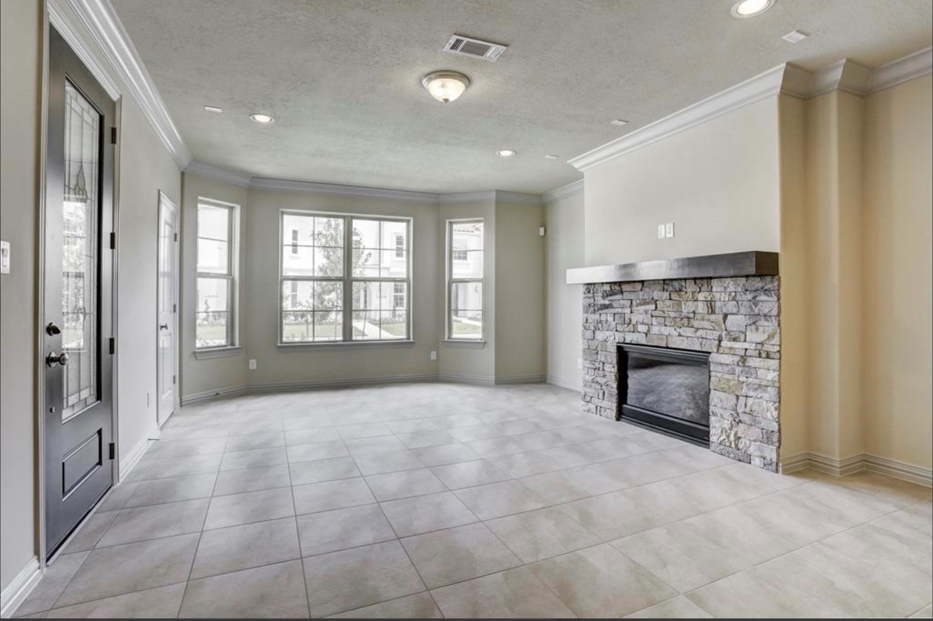 13621 Teal Bluff Lane Houston, TX 77077 - Photo 29 of 29 a view of an empty room with a fireplace and a window