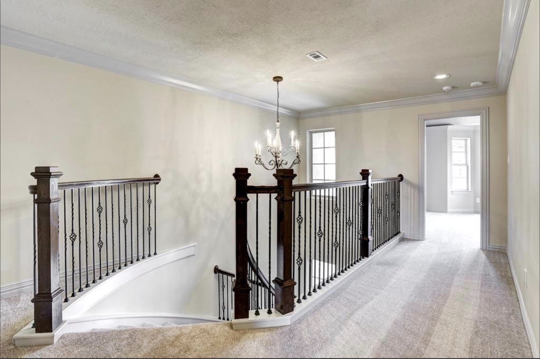 13621 Teal Bluff Lane Houston, TX 77077 - Photo 9 of 29 a view of a hallway with a chandelier