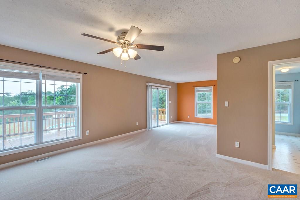 8424 Chestnut Grove Road Esmont, VA 22937 - Photo 14 of 42 a view of a livingroom with a ceiling fan and window