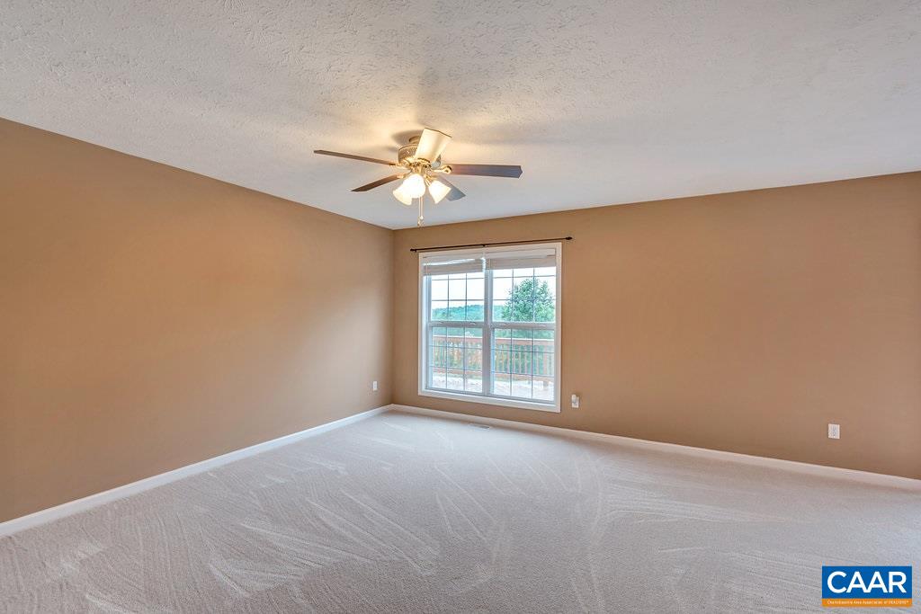 8424 Chestnut Grove Road Esmont, VA 22937 - Photo 16 of 42 an empty room with a window and a ceiling fan