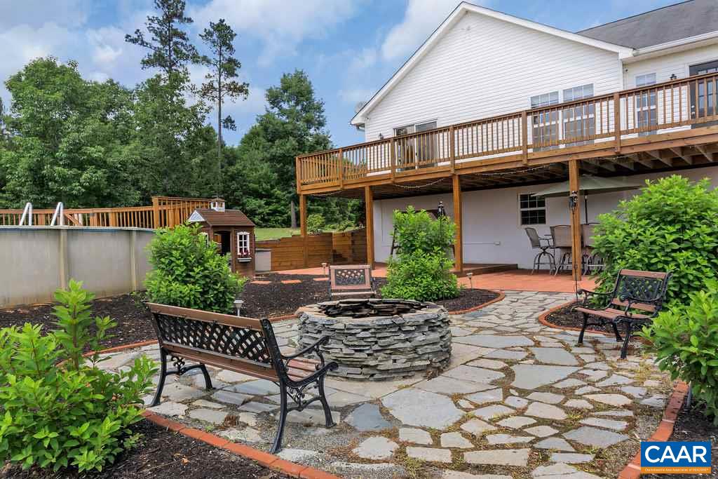 8424 Chestnut Grove Road Esmont, VA 22937 - Photo 2 of 42 a view of backyard with outdoor seating and plants