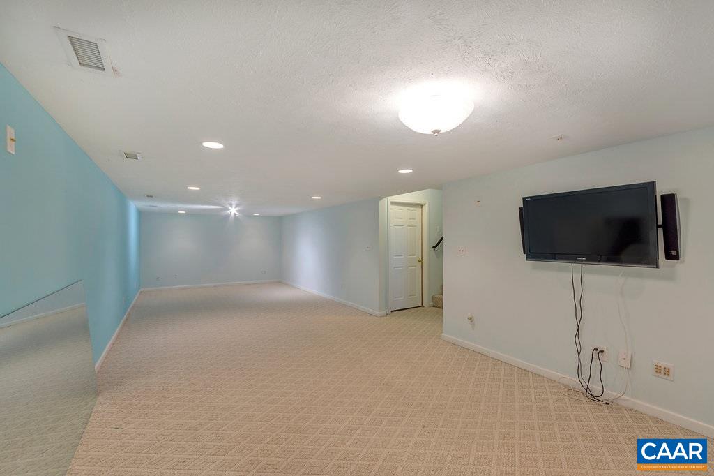 8424 Chestnut Grove Road Esmont, VA 22937 - Photo 24 of 42 a view of a livingroom with a flat screen tv