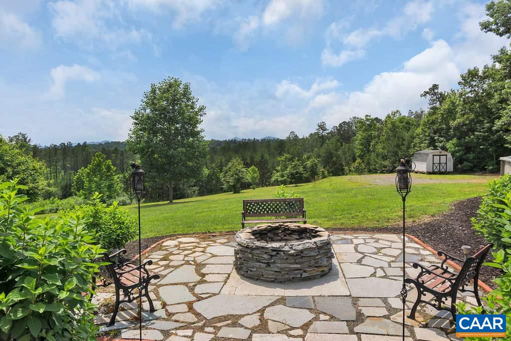 8424 Chestnut Grove Road Esmont, VA 22937 - Photo 28 of 42 a view of a backyard with sitting area
