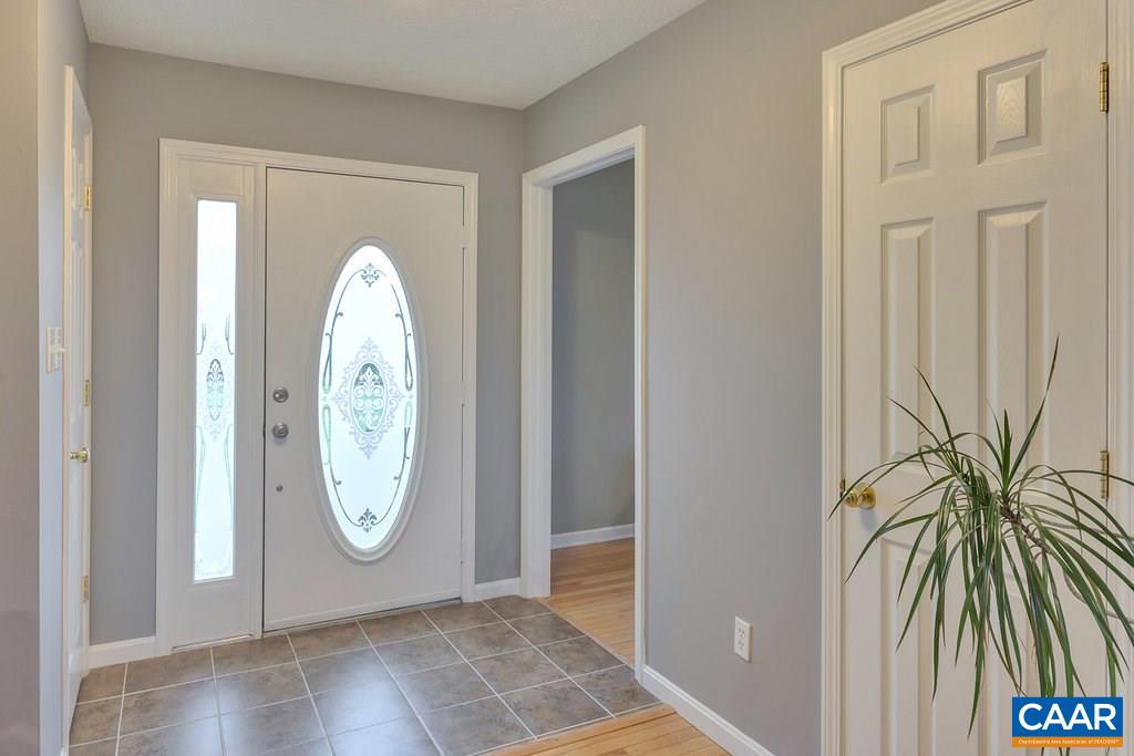 8424 Chestnut Grove Road Esmont, VA 22937 - Photo 4 of 42 a view of a livingroom with wooden floor and entryway