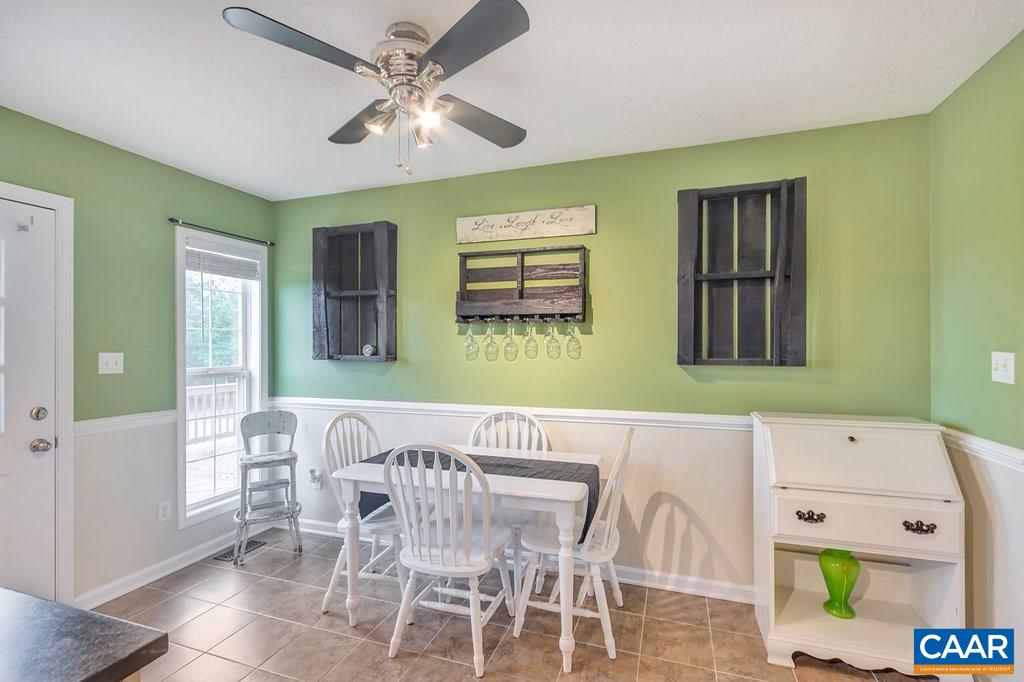 8424 Chestnut Grove Road Esmont, VA 22937 - Photo 10 of 42 a view of a dining room with furniture and chandelier
