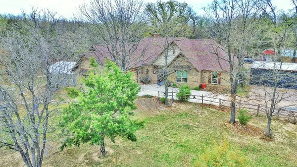 an aerial view of house with yard