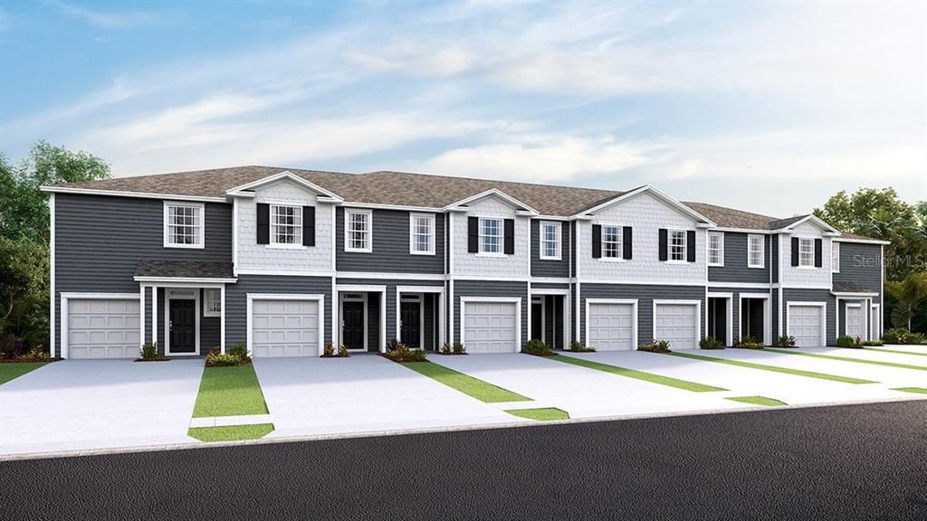 a view of residential houses with yard