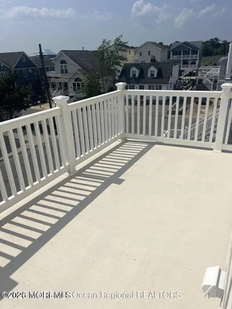 a view of balcony with furniture