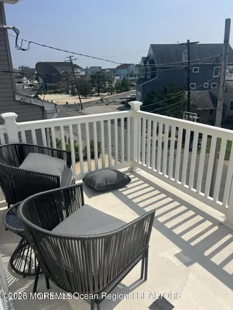 a view of a livingroom with furniture and windows