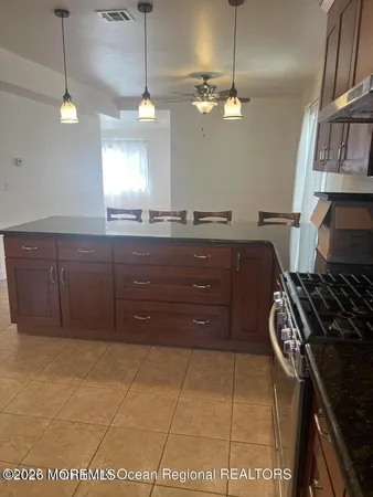 a kitchen with a cabinets and stove