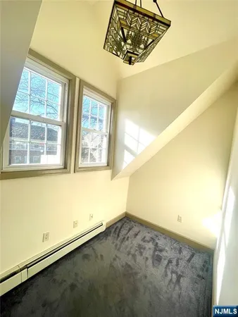 a view of a front door and wooden floor