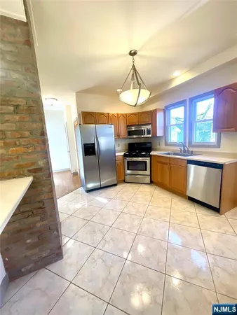 a view of a livingroom with furniture & cabinets