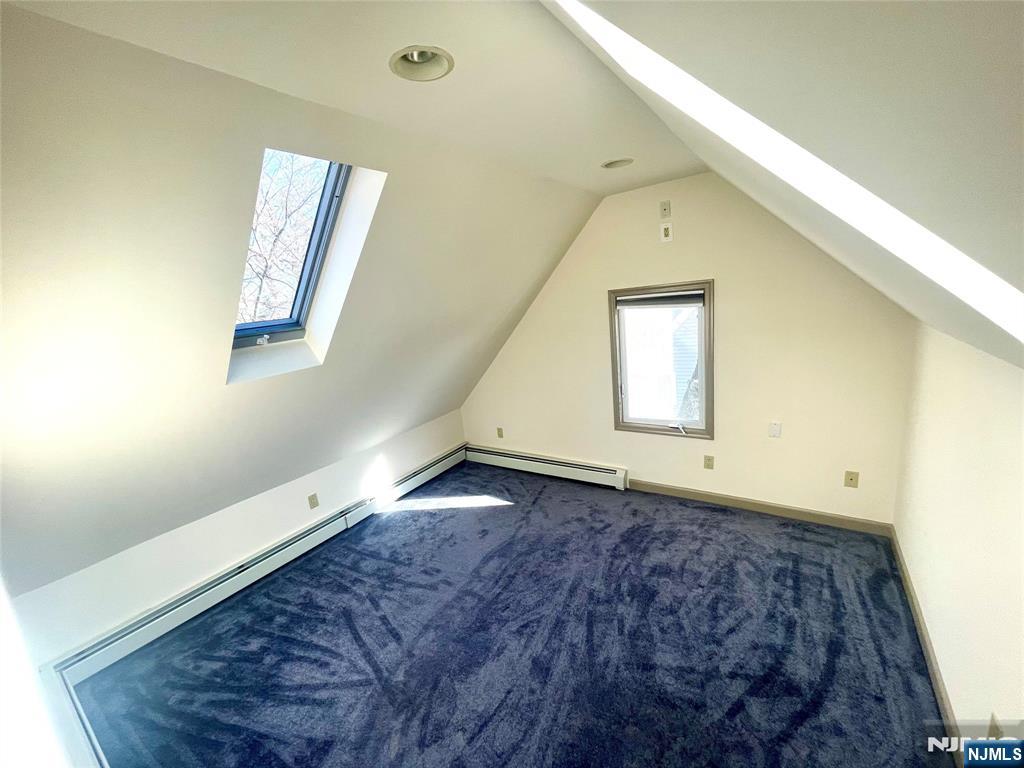 49 East Passaic Avenue, Unit 2 Rutherford, NJ 07070 - Photo 21 of 23 a view of an empty room with window