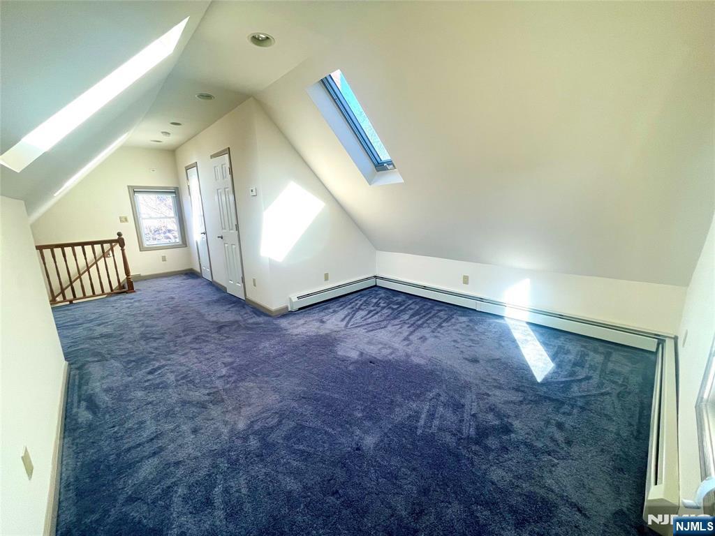 49 East Passaic Avenue, Unit 2 Rutherford, NJ 07070 - Photo 22 of 23 a view of an empty room with wooden floor