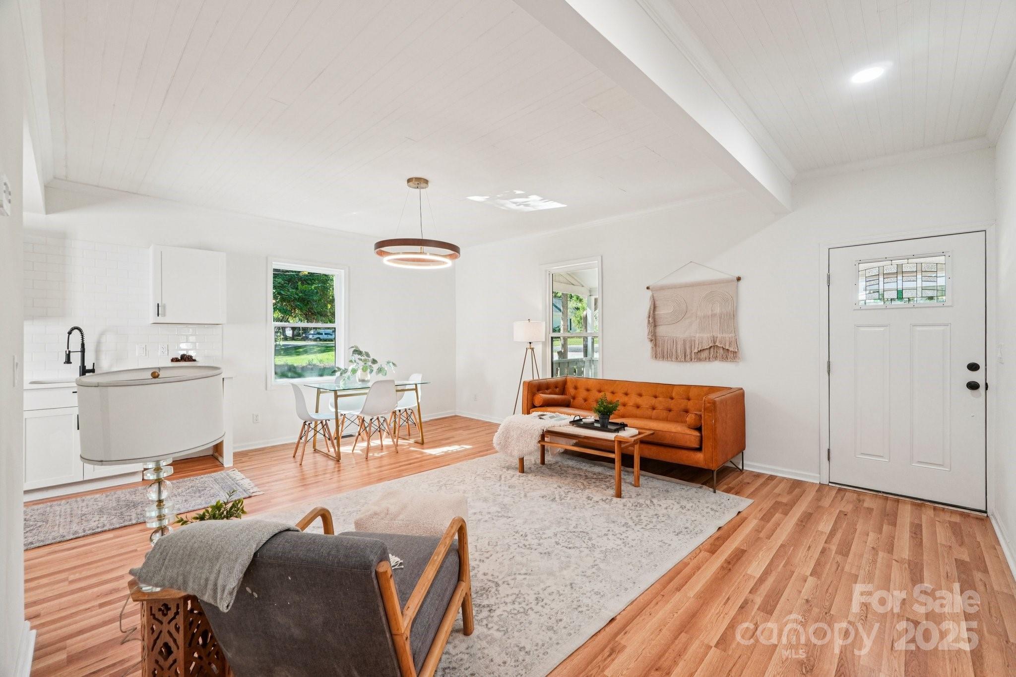 38 6th Street York, SC 29745 - Photo 11 of 34 a living room with furniture and wooden floor