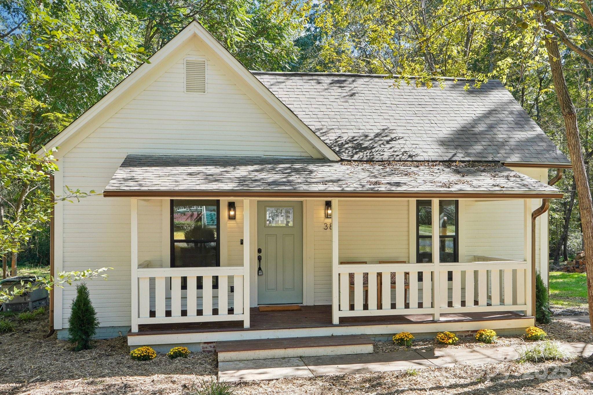 38 6th Street York, SC 29745 - Photo 2 of 34 a view of a house with a small yard and wooden fence