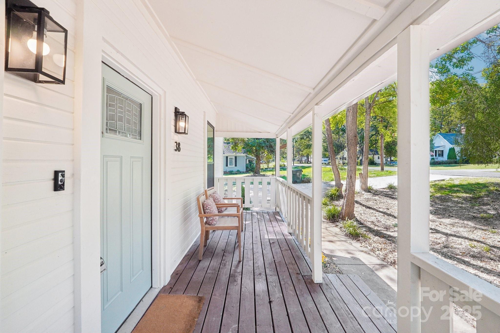 38 6th Street York, SC 29745 - Photo 21 of 34 a view of a balcony with chairs and wooden floor