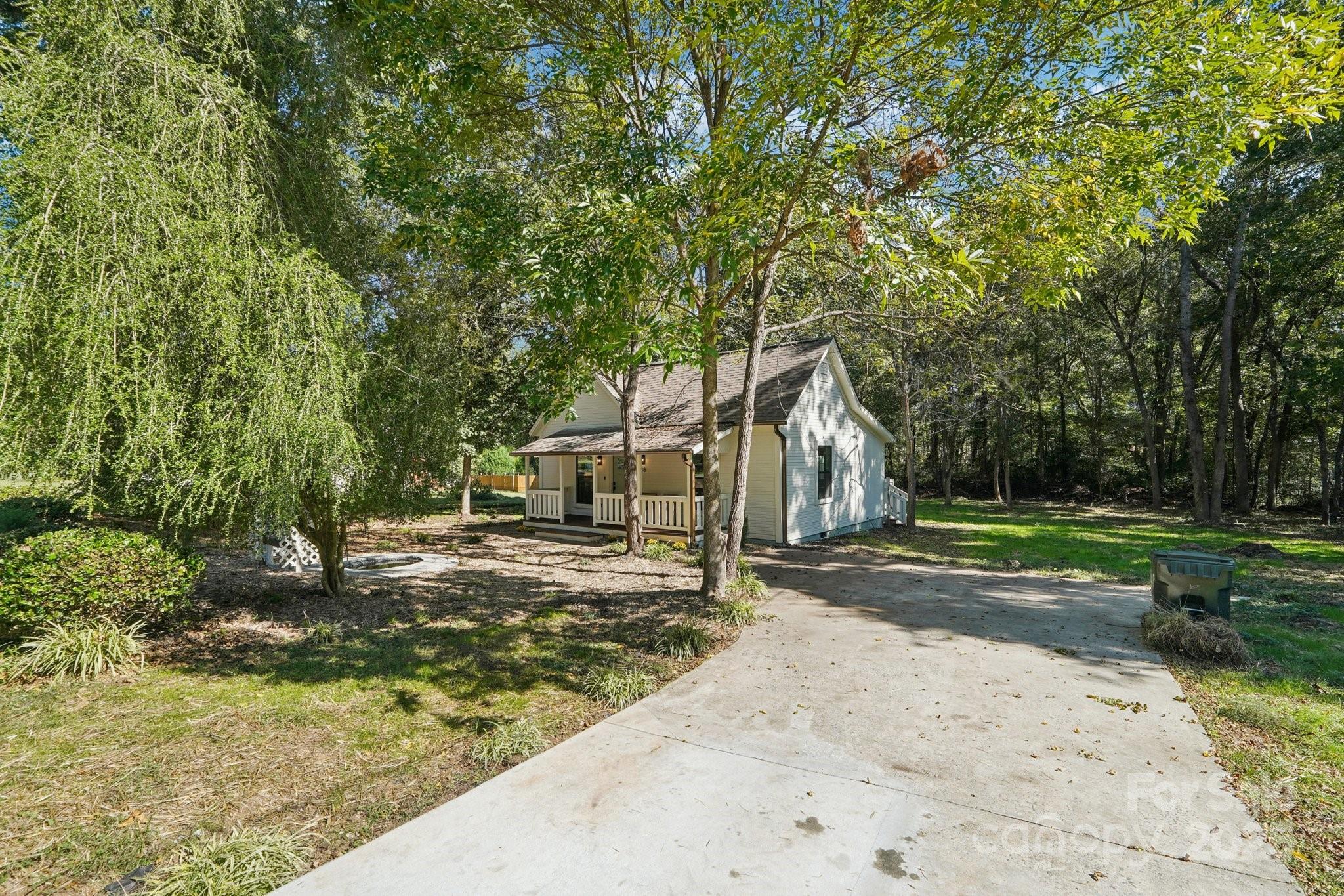 38 6th Street York, SC 29745 - Photo 24 of 34 a dirt road with trees in the background