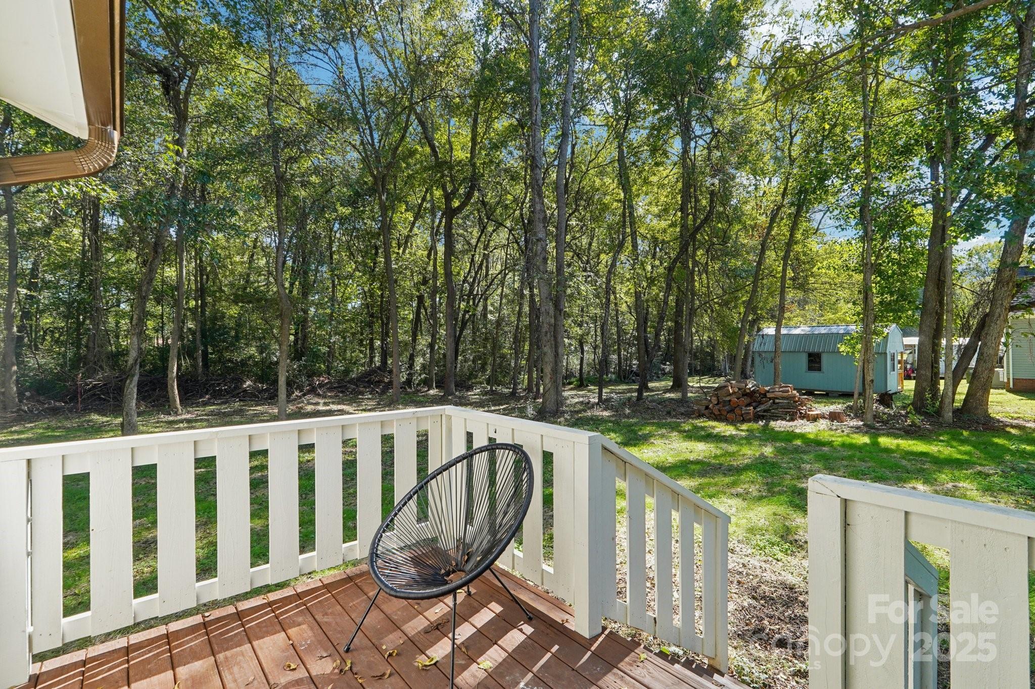38 6th Street York, SC 29745 - Photo 28 of 34 a view of a deck with furniture and trees around