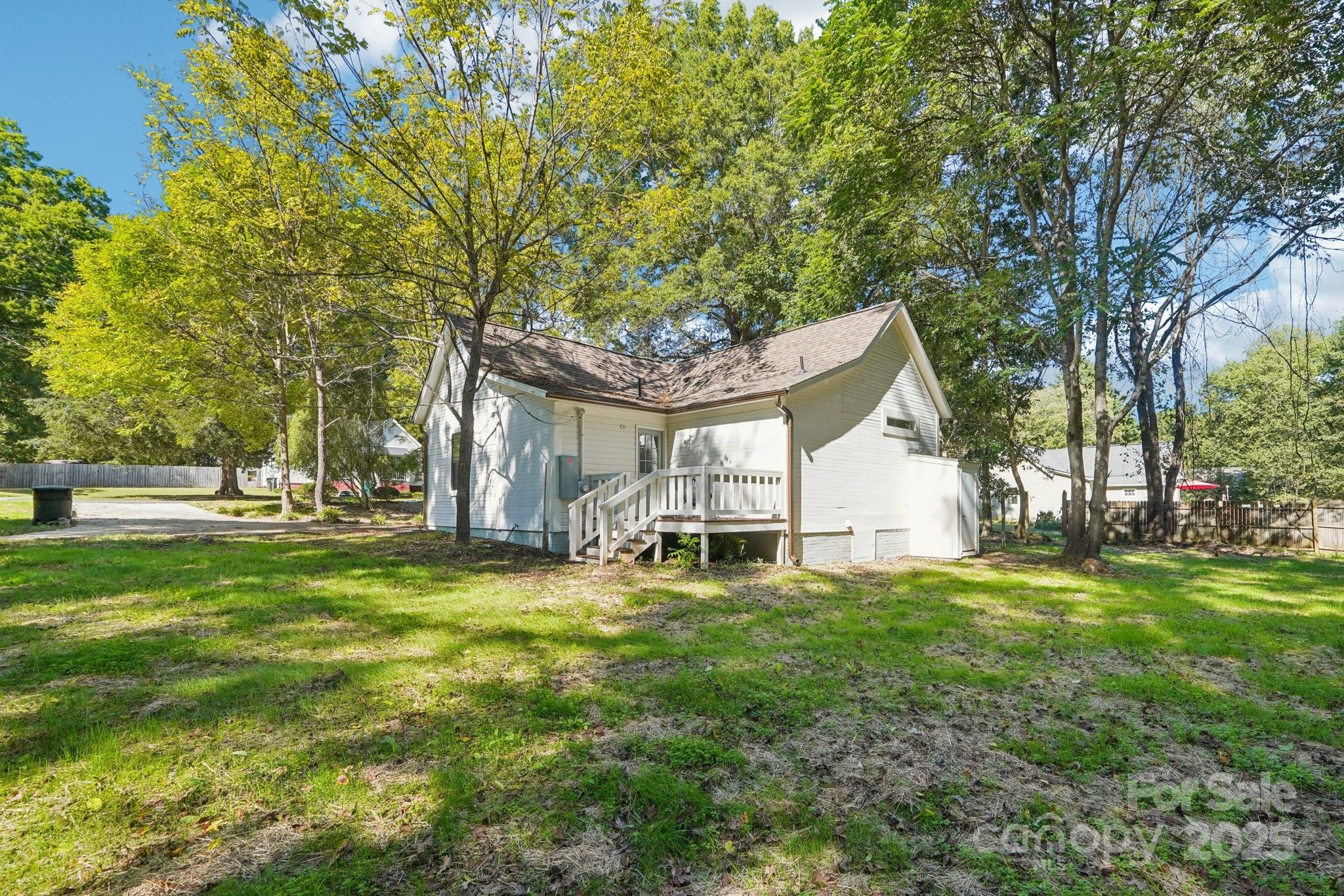 38 6th Street York, SC 29745 - Photo 30 of 34 a big room with trees and plants