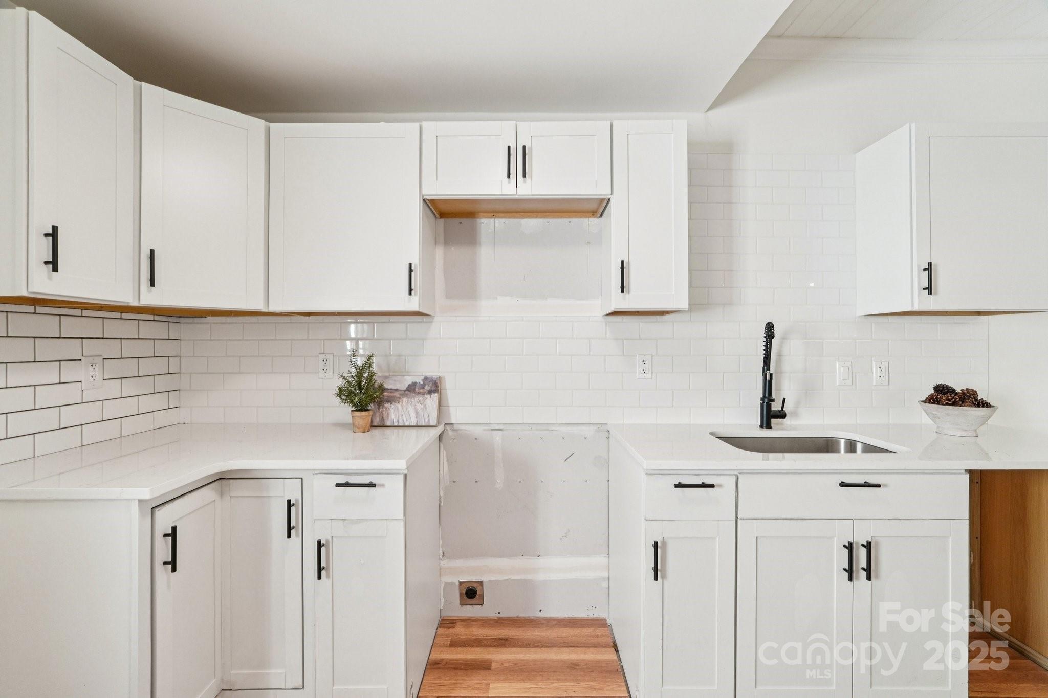 38 6th Street York, SC 29745 - Photo 3 of 34 a kitchen with a sink and cabinets