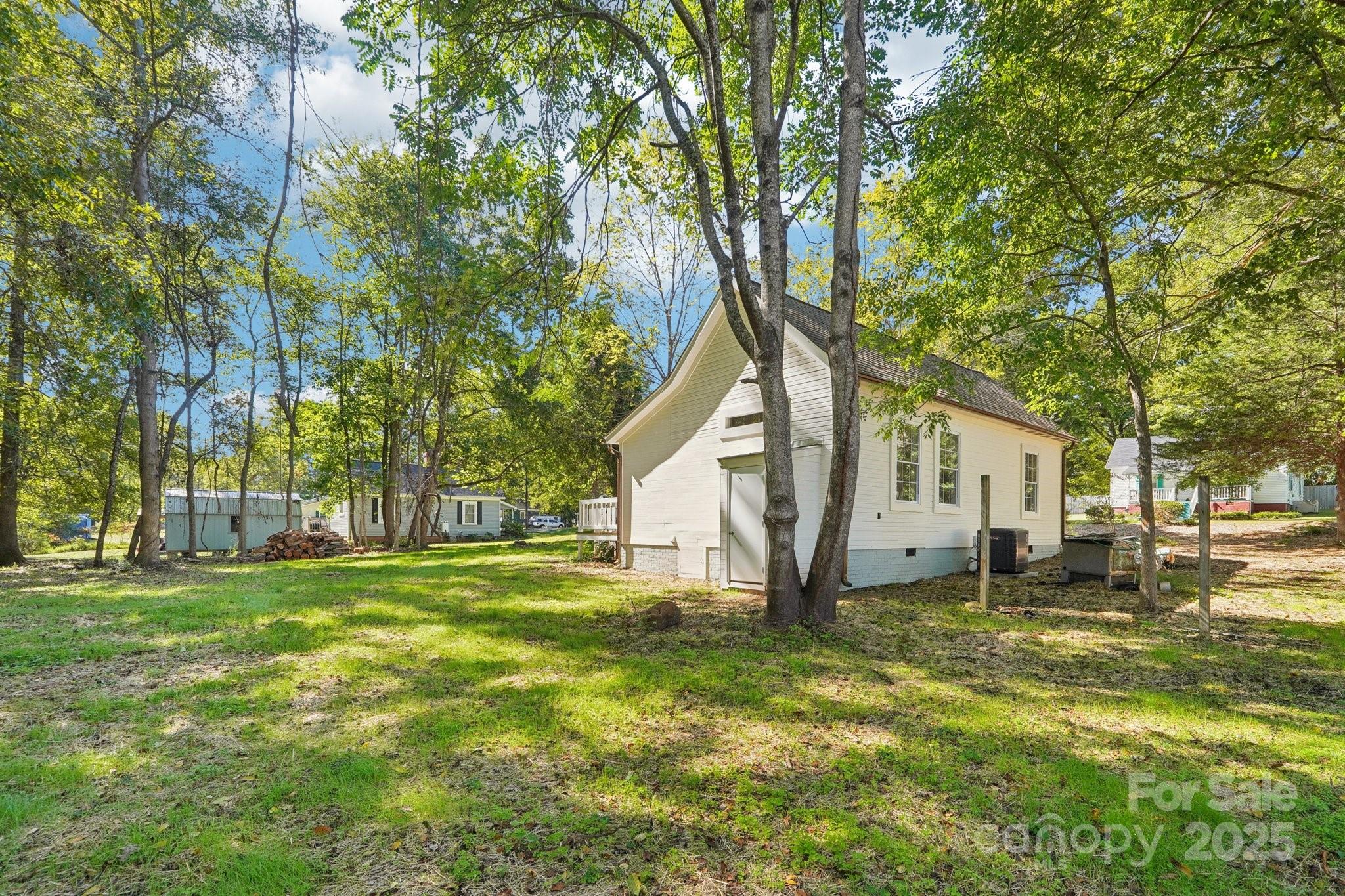 38 6th Street York, SC 29745 - Photo 33 of 34 a tree in front of a white house