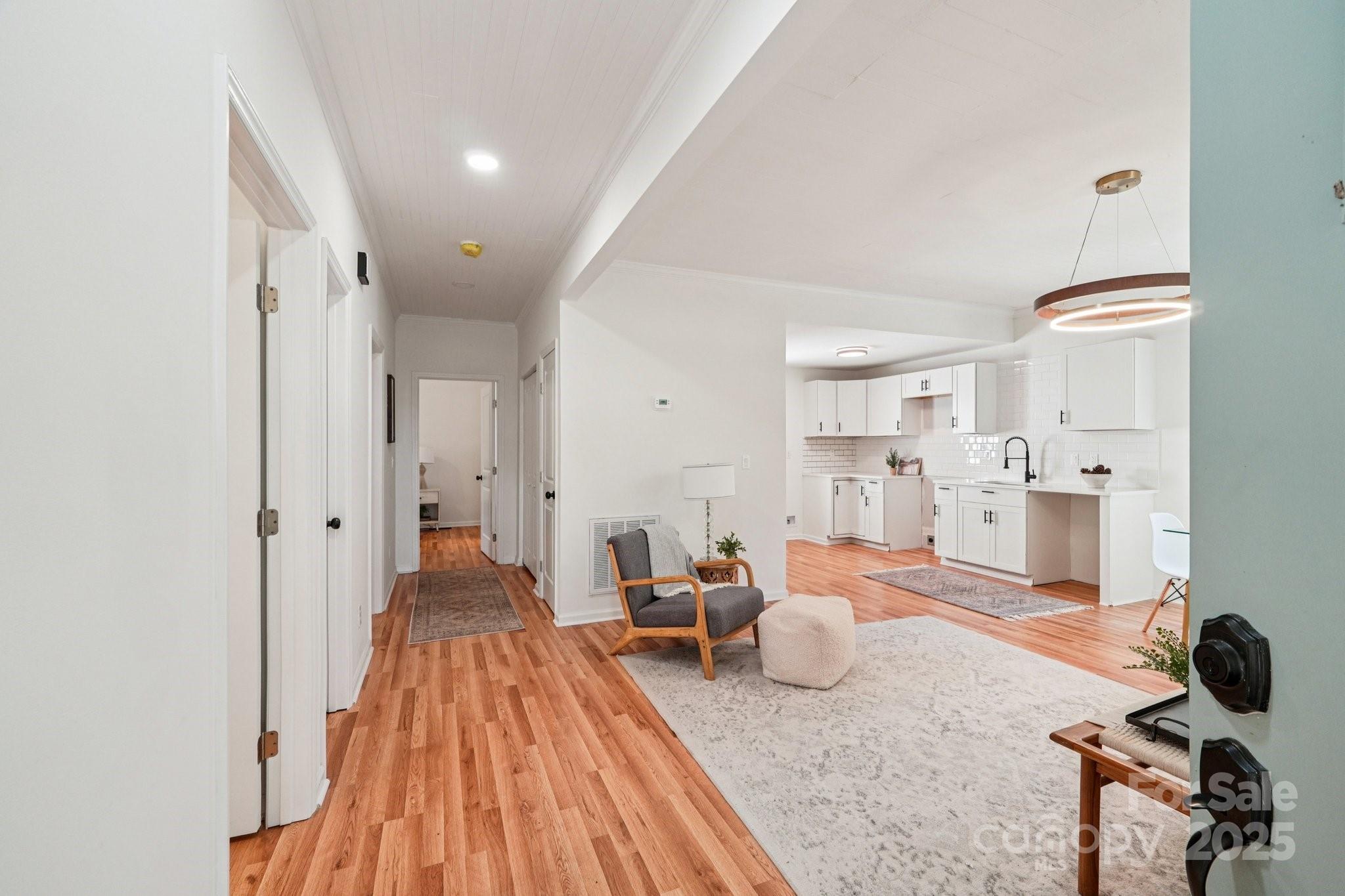 38 6th Street York, SC 29745 - Photo 7 of 34 a living room with furniture and a wooden floor