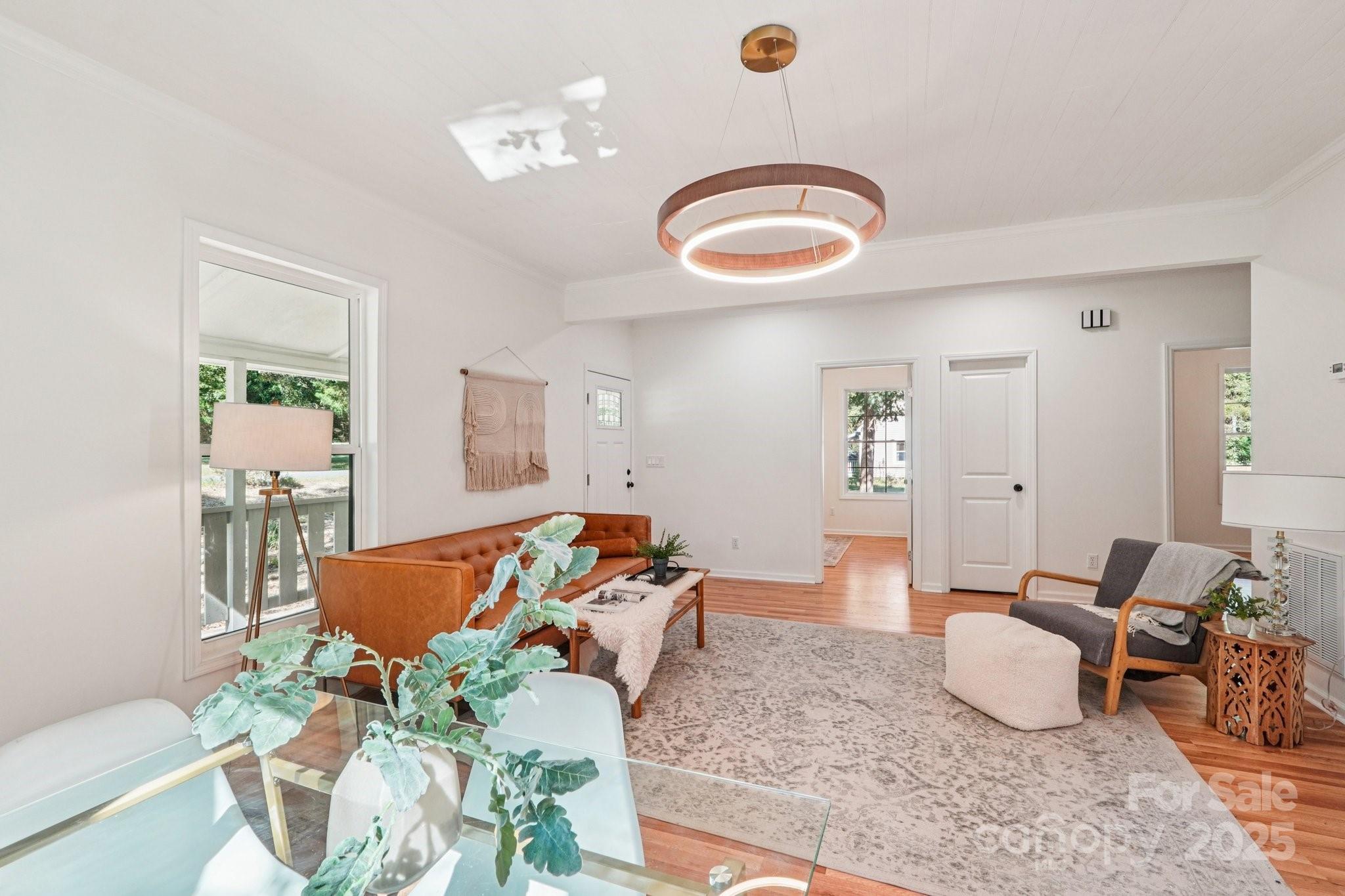 38 6th Street York, SC 29745 - Photo 9 of 34 a living room with furniture potted plant and a rug
