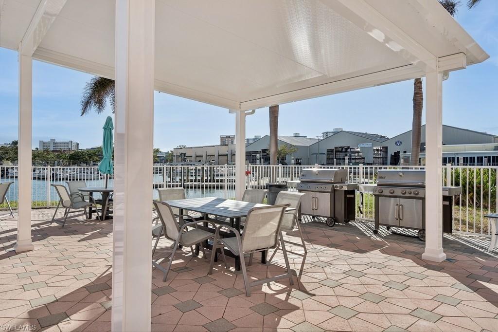 170 Lenell Road, Unit 403 Fort Myers Beach, FL 33931 - Photo 20 of 23 a view of a dining room with furniture