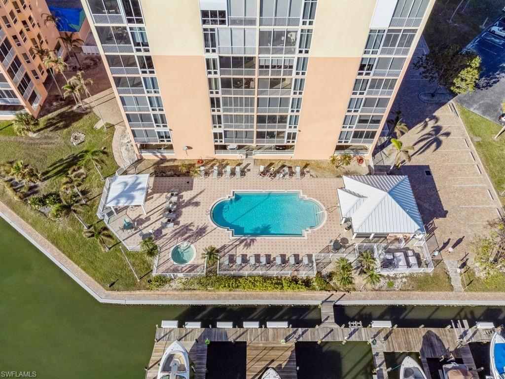 170 Lenell Road, Unit 403 Fort Myers Beach, FL 33931 - Photo 3 of 23 a room with table and chairs