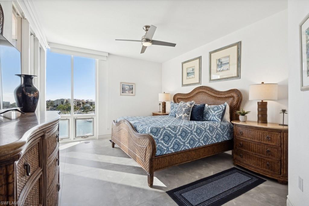 170 Lenell Road, Unit 403 Fort Myers Beach, FL 33931 - Photo 10 of 23 a bedroom with a bed and cabinets