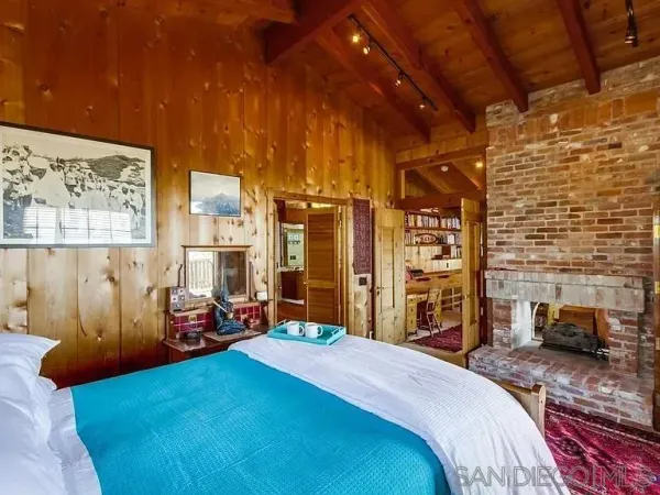 a bedroom with a bed and a walk in closet