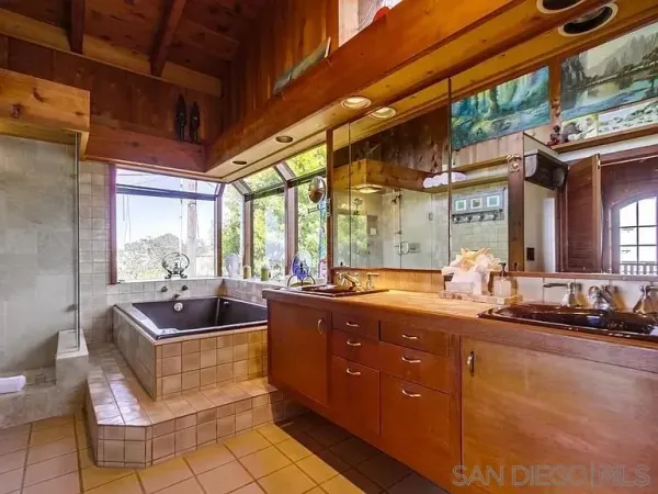 a kitchen with stainless steel appliances granite countertop a sink and wooden cabinets