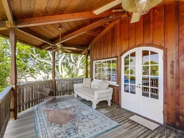 a bedroom with a bed next to a window
