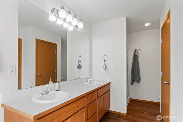 a bathroom with a sink vanity and a mirror