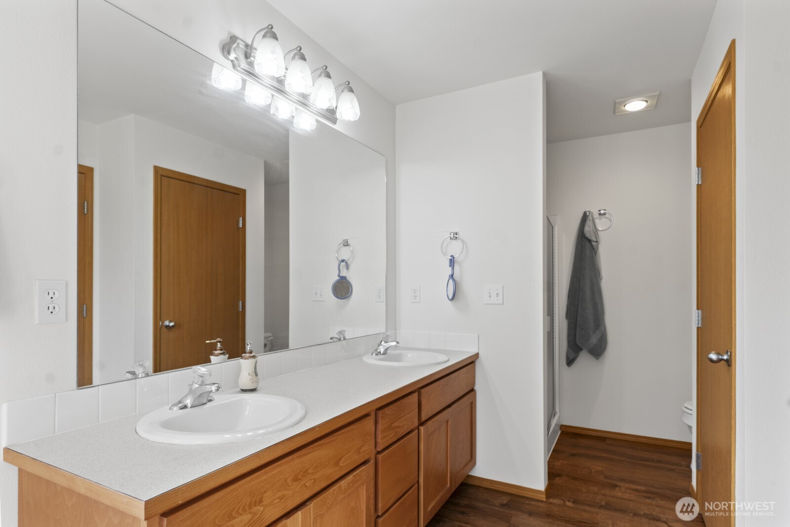 7245 185th Lane Southwest Rochester, WA 98579 - Photo 16 of 29 a bathroom with a sink vanity and a mirror
