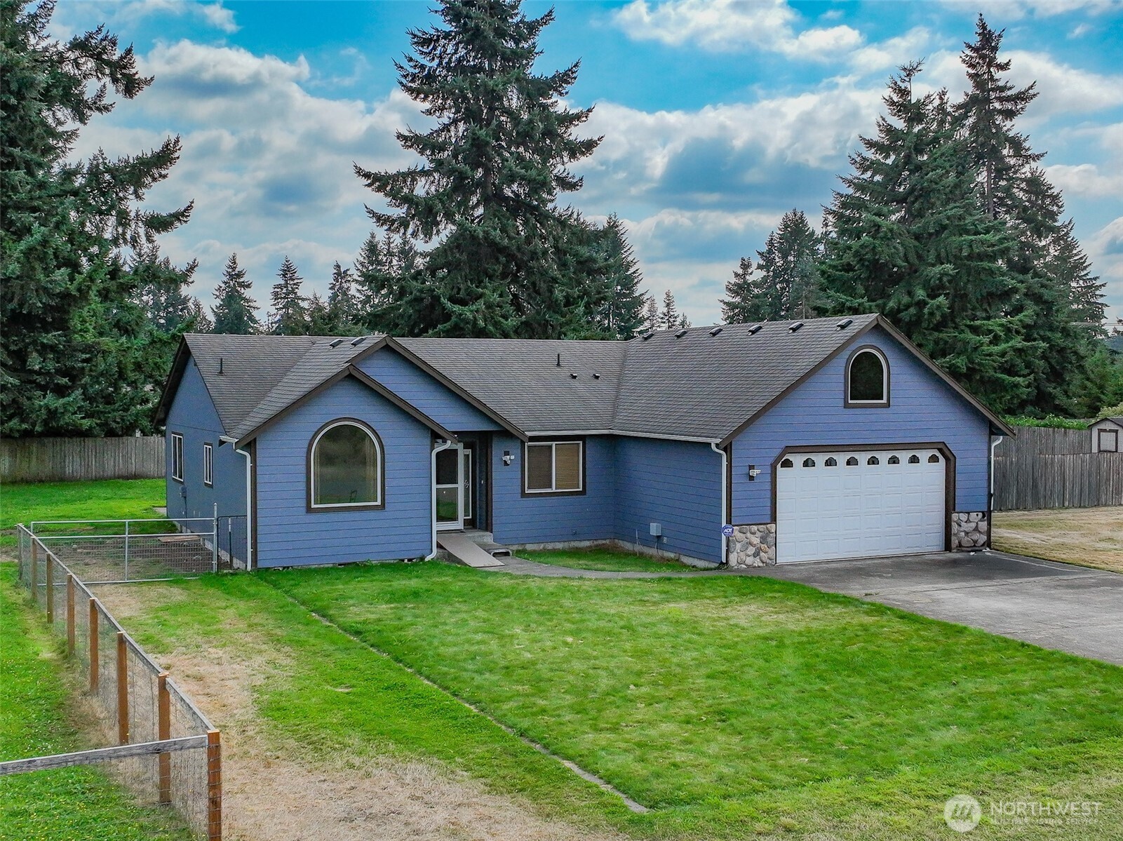 7245 185th Lane Southwest Rochester, WA 98579 - Photo 22 of 29 a front view of house with yard and green space