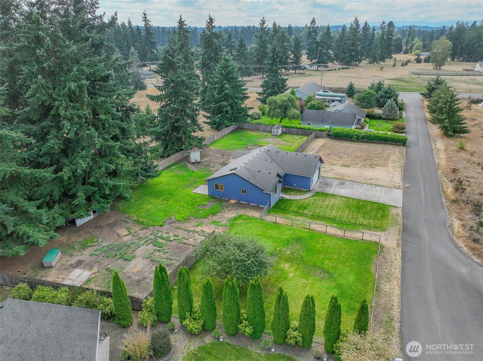 7245 185th Lane Southwest Rochester, WA 98579 - Photo 25 of 29 a view of a garden with an outdoor space