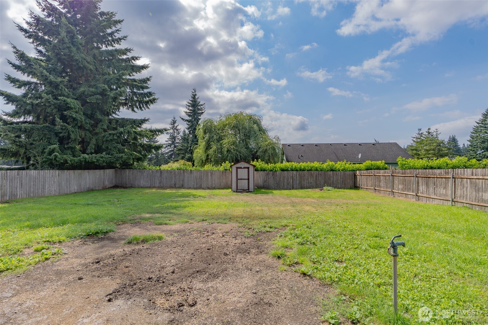 7245 185th Lane Southwest Rochester, WA 98579 - Photo 28 of 29 a view of a yard with a trampoline