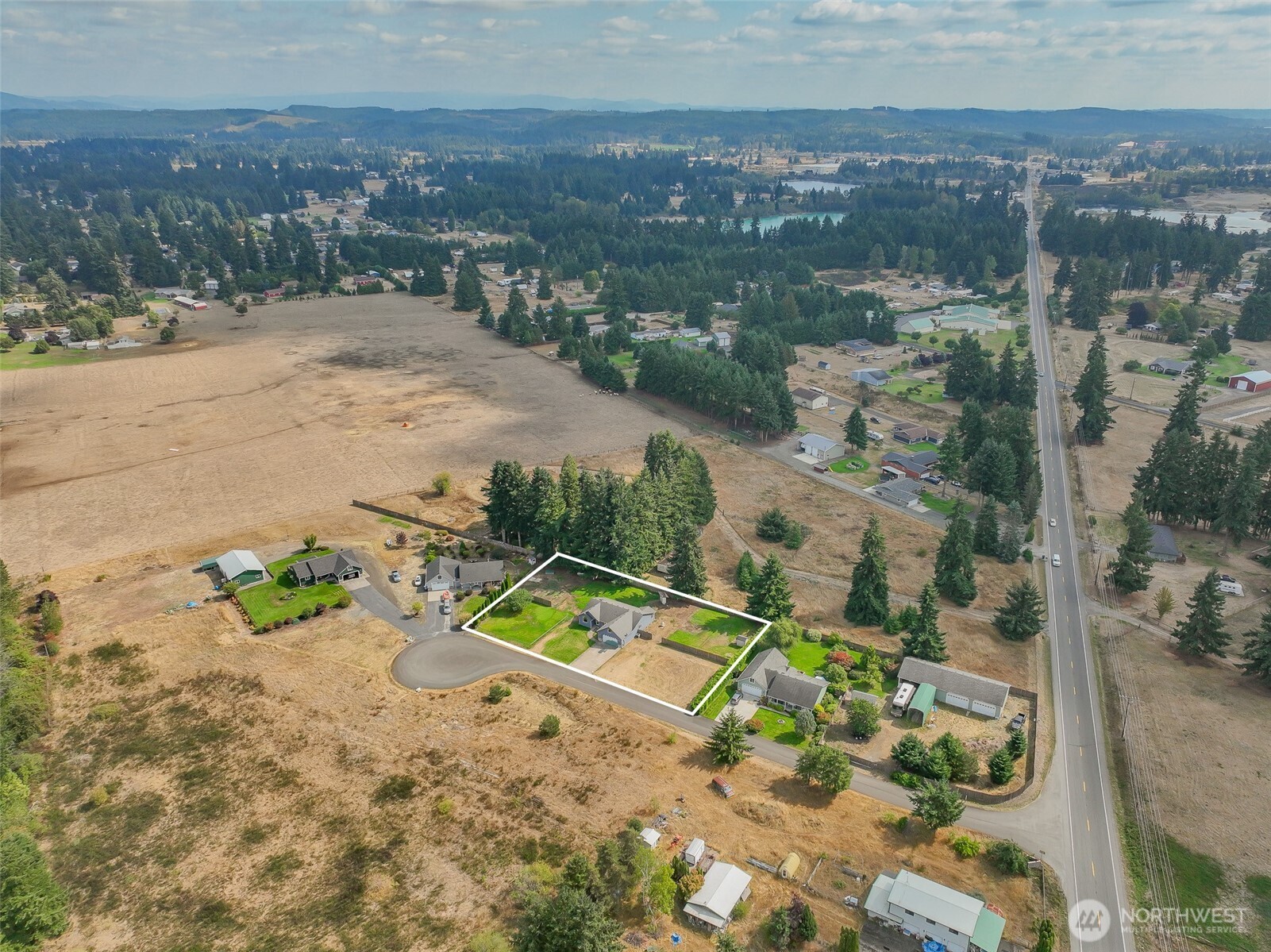 7245 185th Lane Southwest Rochester, WA 98579 - Photo 3 of 29 an aerial view of a house with a garden