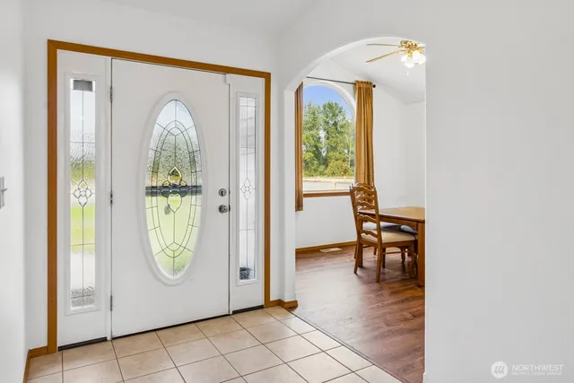 a view of a livingroom with furniture and a window