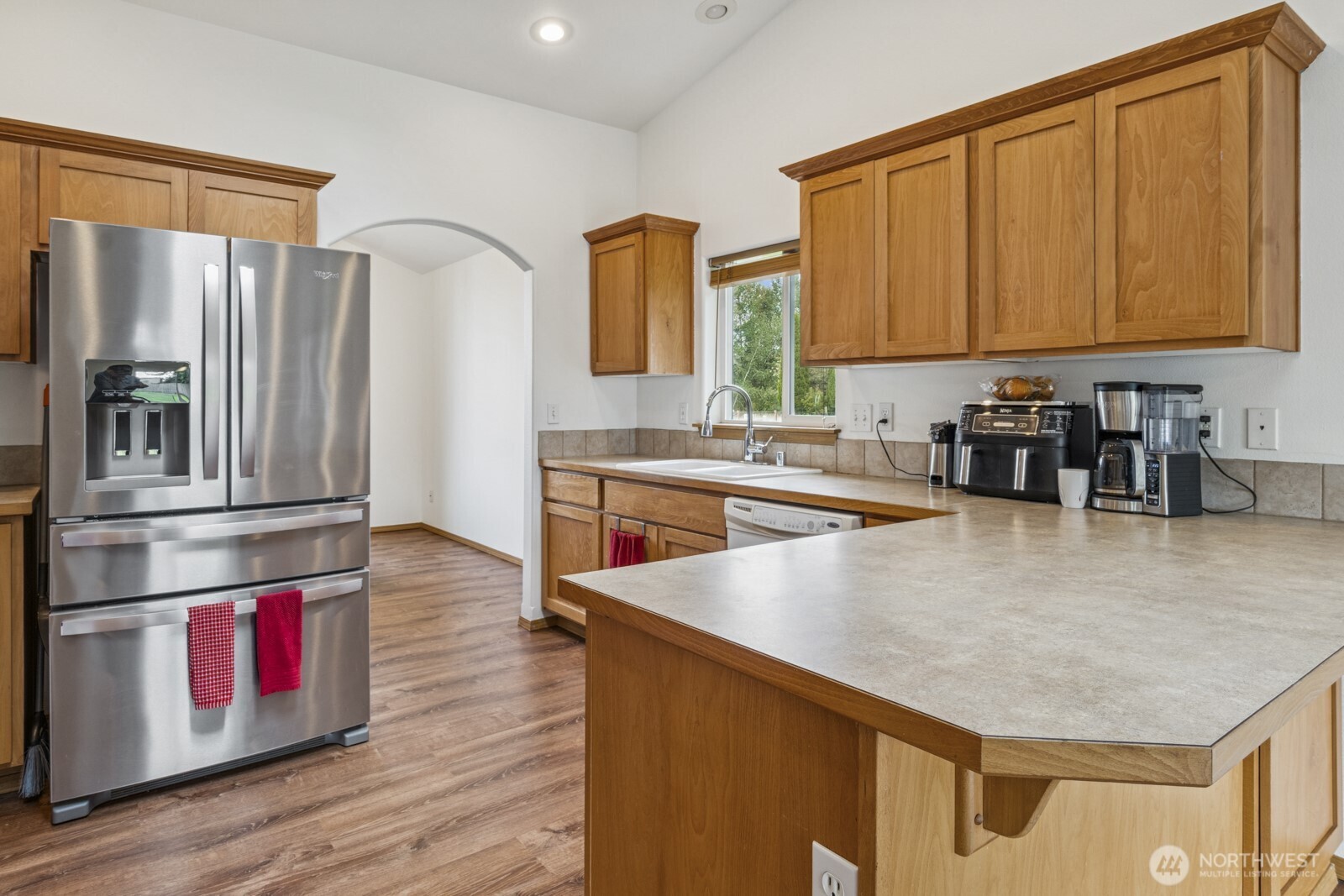 7245 185th Lane Southwest Rochester, WA 98579 - Photo 5 of 29 a kitchen with stainless steel appliances granite countertop a stove a sink and a refrigerator