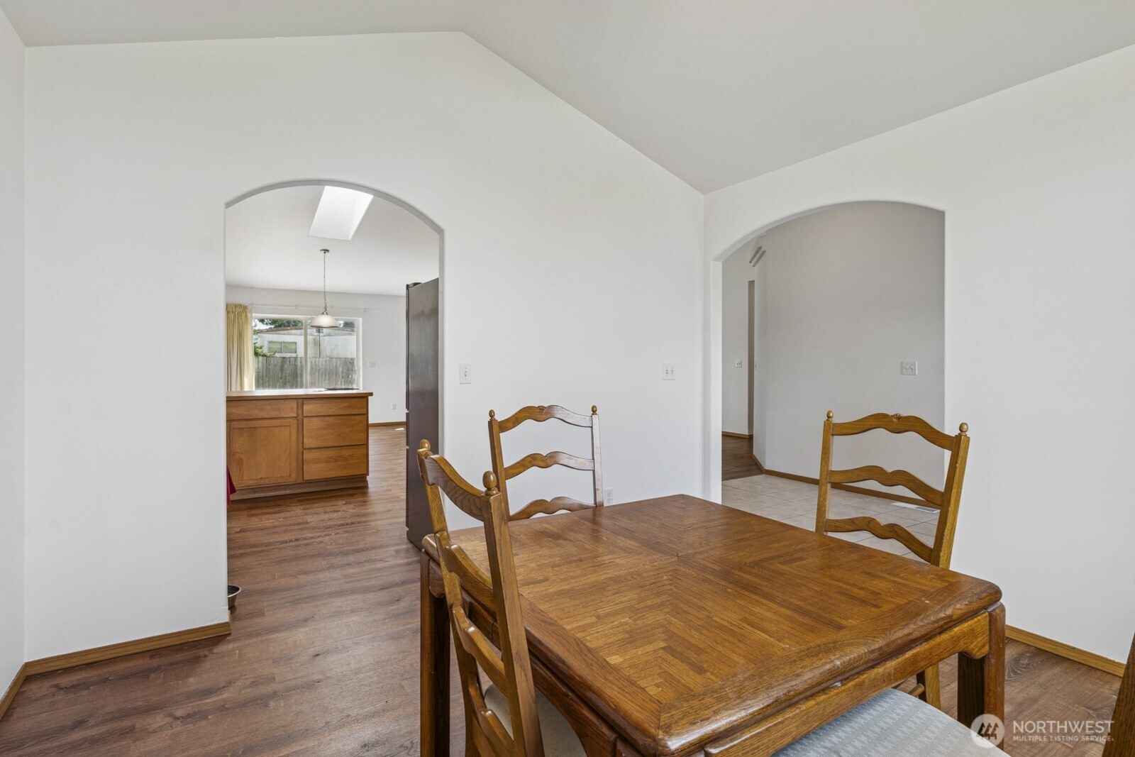 7245 185th Lane Southwest Rochester, WA 98579 - Photo 9 of 29 a room with a table chairs and wooden floor