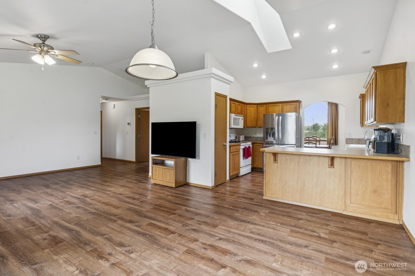 7245 185th Lane Southwest Rochester, WA 98579 - Photo 10 of 29 a view of a kitchen with furniture and a ceiling fan