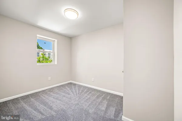 an empty room with windows and window