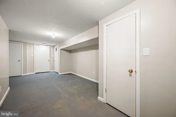 an empty room with closet area
